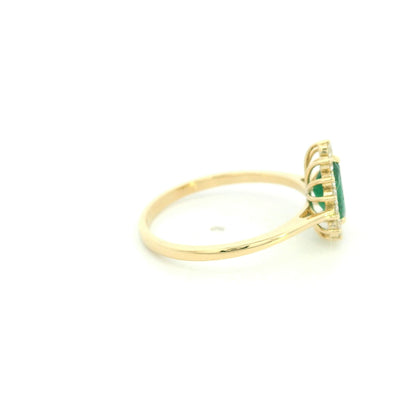 Pear shaped natural emerald diamond halo ring in 18K yellow gold