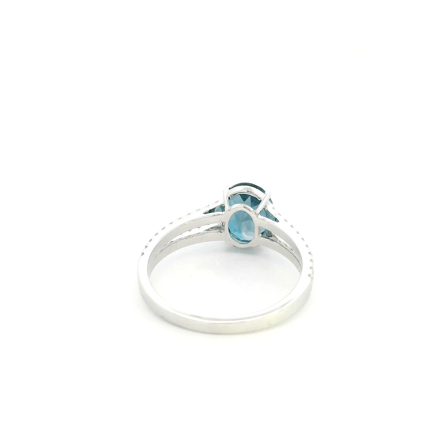Natural London Blue Topaz ring in 18K white gold featuring a 2.22 carat oval London Blue Topaz with a split shank and 0.36 carat natural diamond band.
