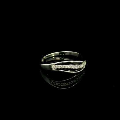 18K white gold diamond wave ring with a curved row of round diamonds and flowing polished gold design