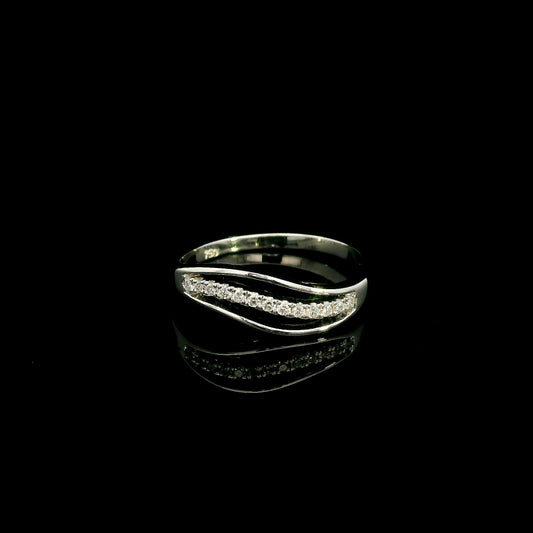 18K white gold diamond wave ring with a curved row of round diamonds and flowing polished gold design