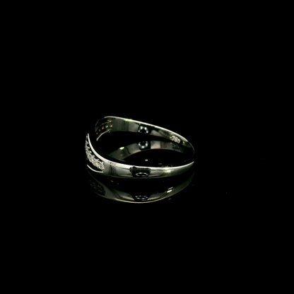 18K white gold diamond wave ring with a curved row of round diamonds and flowing polished gold design