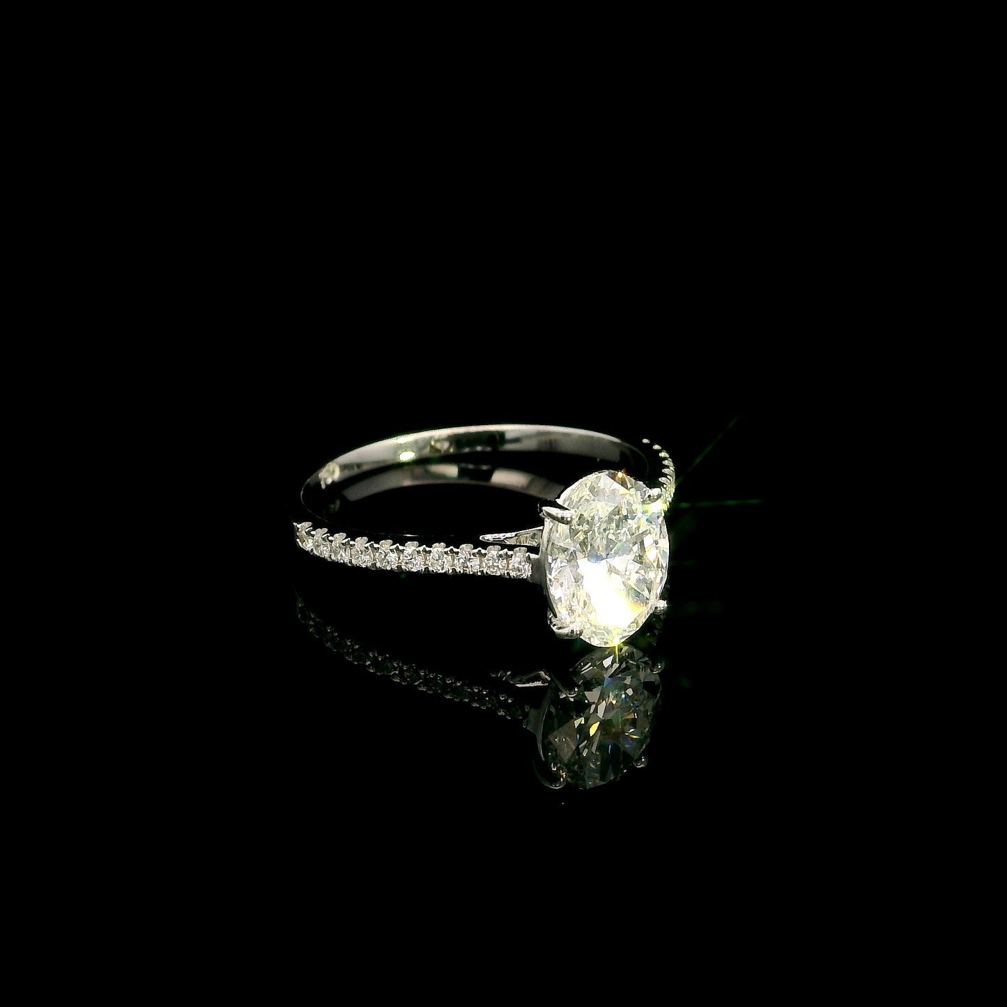 Oval cut diamond bridal set in 18K white gold featuring a GIA certified 1.50 carat natural oval diamond with matching diamond wedding band.