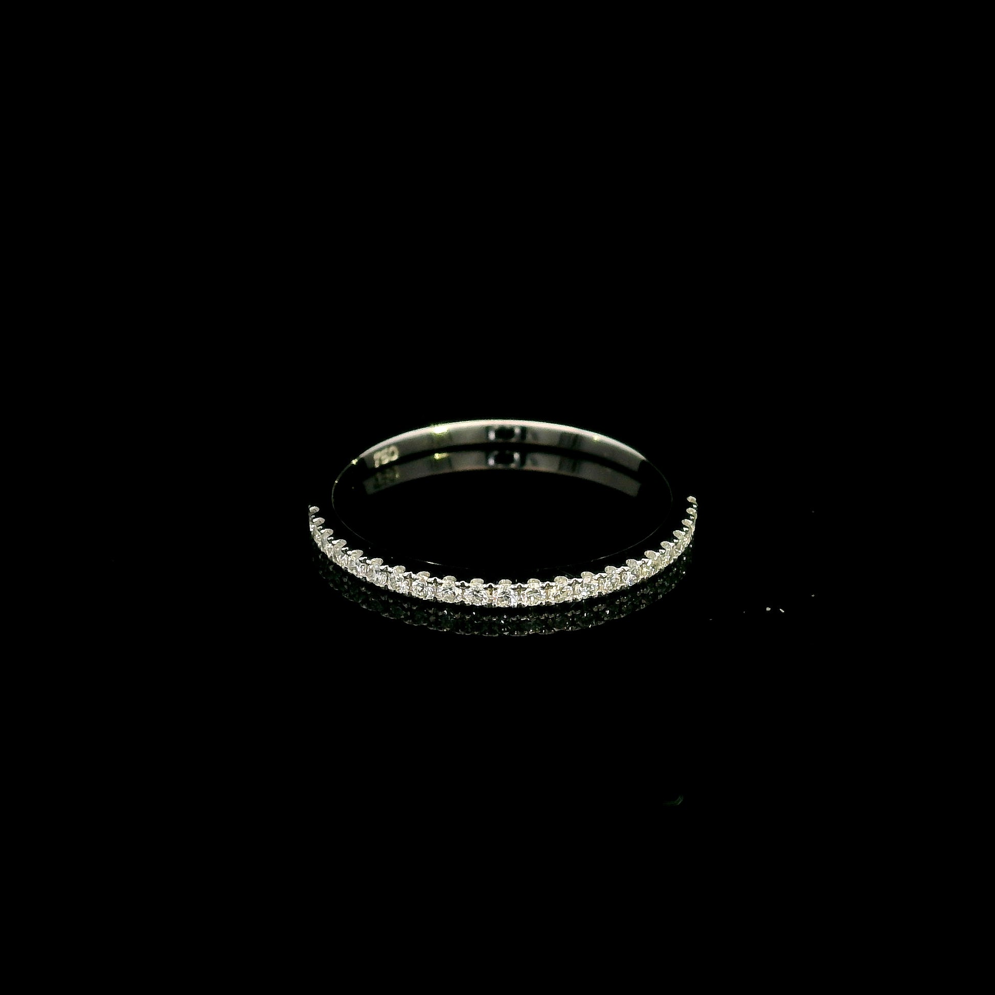 Oval cut diamond bridal set in 18K white gold featuring a GIA certified 1.50 carat natural oval diamond with matching diamond wedding band.
