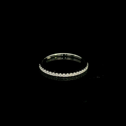 Oval cut diamond bridal set in 18K white gold featuring a GIA certified 1.50 carat natural oval diamond with matching diamond wedding band.
