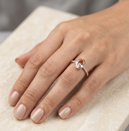 Oval morganite diamond ring handcrafted in 18K rose gold featuring a 1.84 carat natural oval morganite with 0.16 carat natural diamond pavé band.