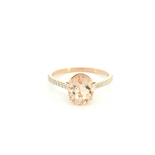 Oval morganite diamond ring handcrafted in 18K rose gold featuring a 1.84 carat natural oval morganite with 0.16 carat natural diamond pavé band.