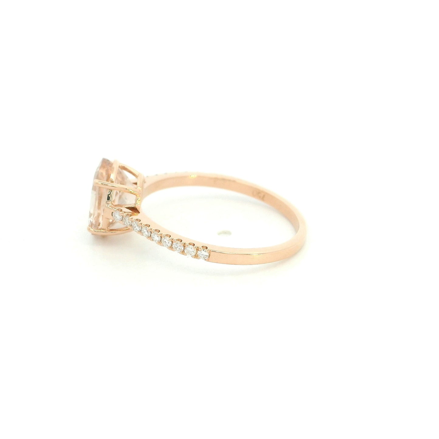 Oval morganite diamond ring handcrafted in 18K rose gold featuring a 1.84 carat natural oval morganite with 0.16 carat natural diamond pavé band.