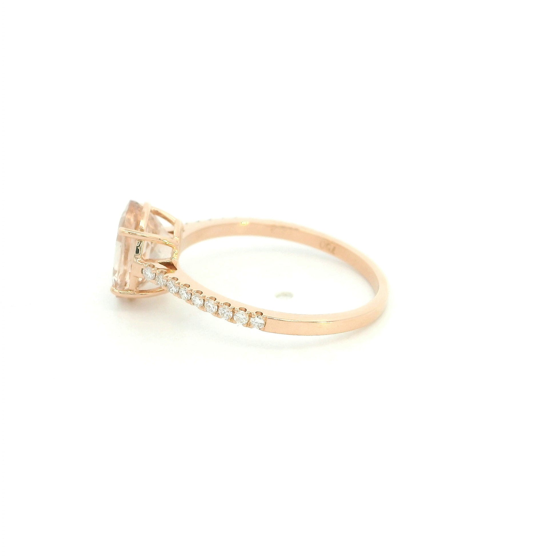 Oval morganite diamond ring handcrafted in 18K rose gold featuring a 1.84 carat natural oval morganite with 0.16 carat natural diamond pavé band.