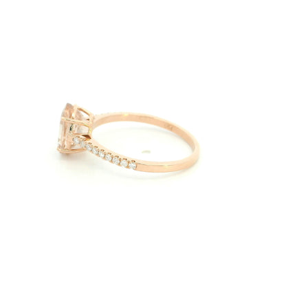 Oval morganite diamond ring handcrafted in 18K rose gold featuring a 1.84 carat natural oval morganite with 0.16 carat natural diamond pavé band.