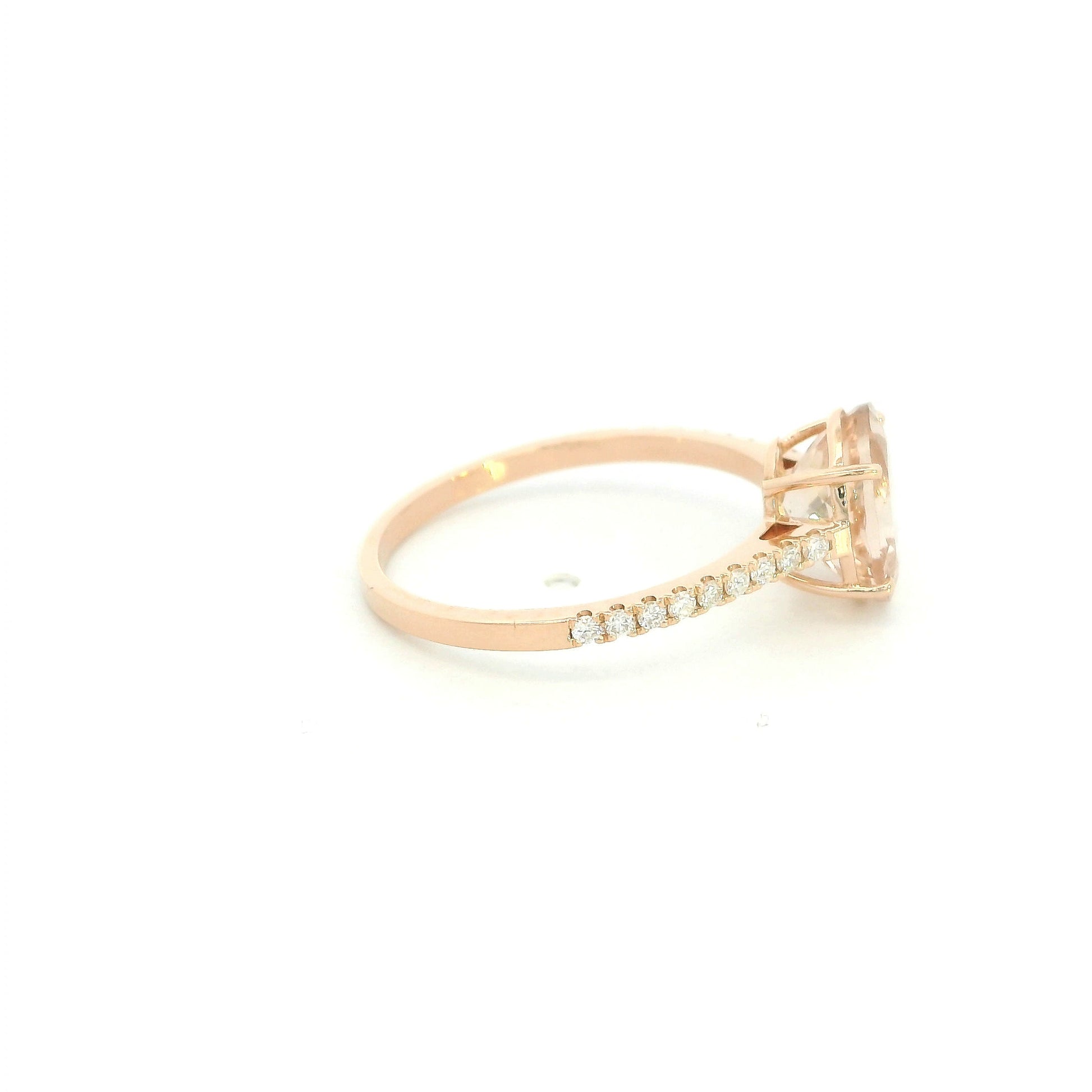 Oval morganite diamond ring handcrafted in 18K rose gold featuring a 1.84 carat natural oval morganite with 0.16 carat natural diamond pavé band.