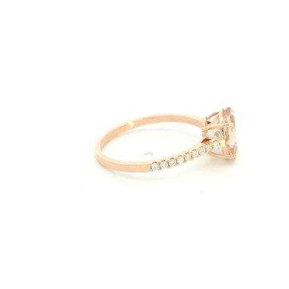 Oval morganite diamond ring handcrafted in 18K rose gold featuring a 1.84 carat natural oval morganite with 0.16 carat natural diamond pavé band.
