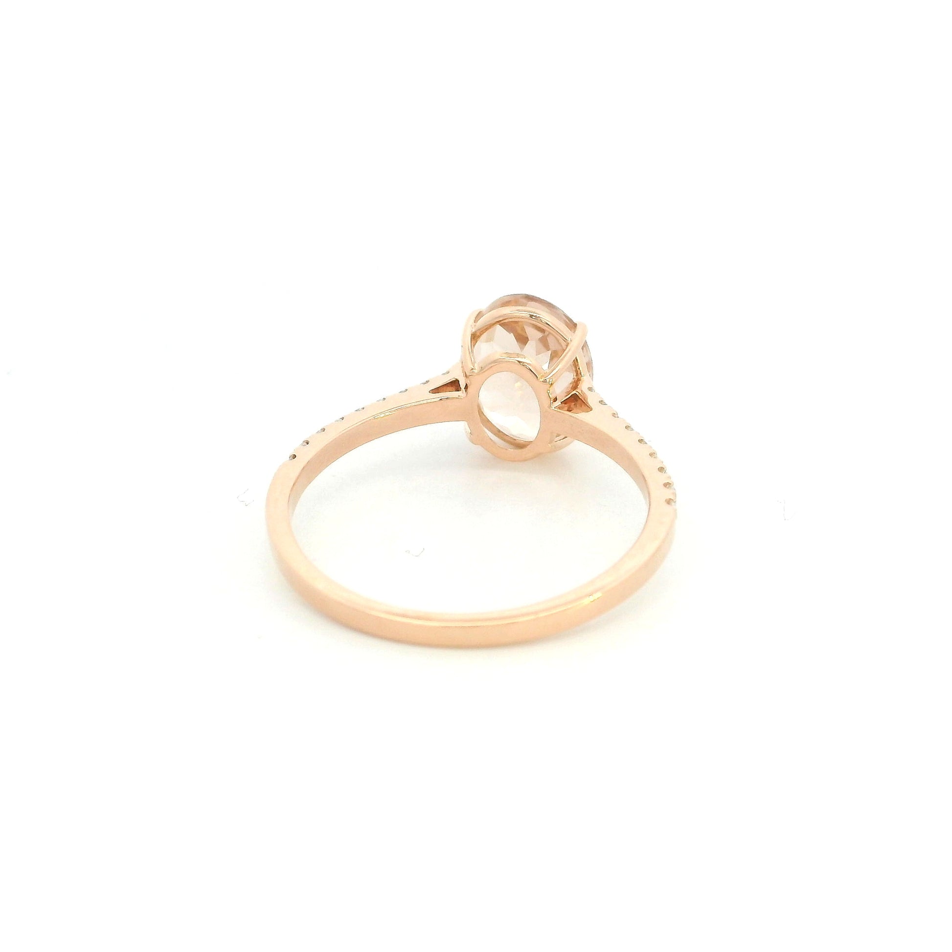 Oval morganite diamond ring handcrafted in 18K rose gold featuring a 1.84 carat natural oval morganite with 0.16 carat natural diamond pavé band.