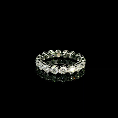 Full diamond eternity ring with round brilliant diamonds set around the entire band in 18K white gold.