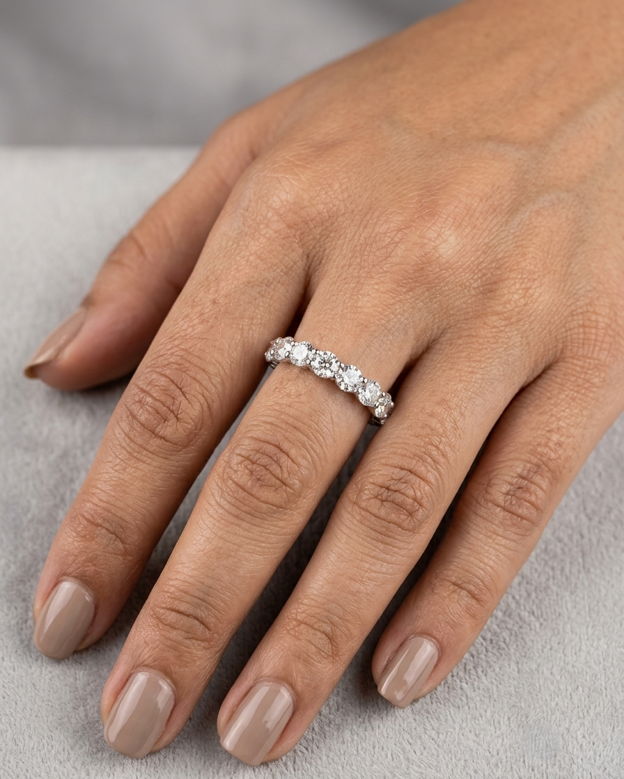 Full diamond eternity ring with round brilliant diamonds set around the entire band in 18K white gold.