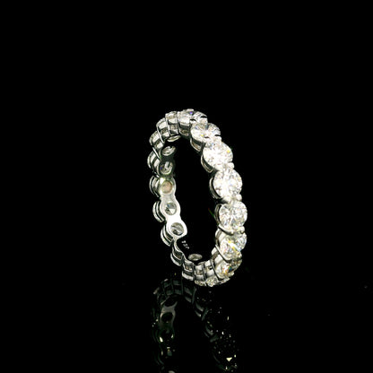 Full diamond eternity ring with round brilliant diamonds set around the entire band in 18K white gold.