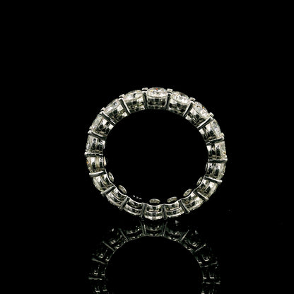 Full diamond eternity ring with round brilliant diamonds set around the entire band in 18K white gold.