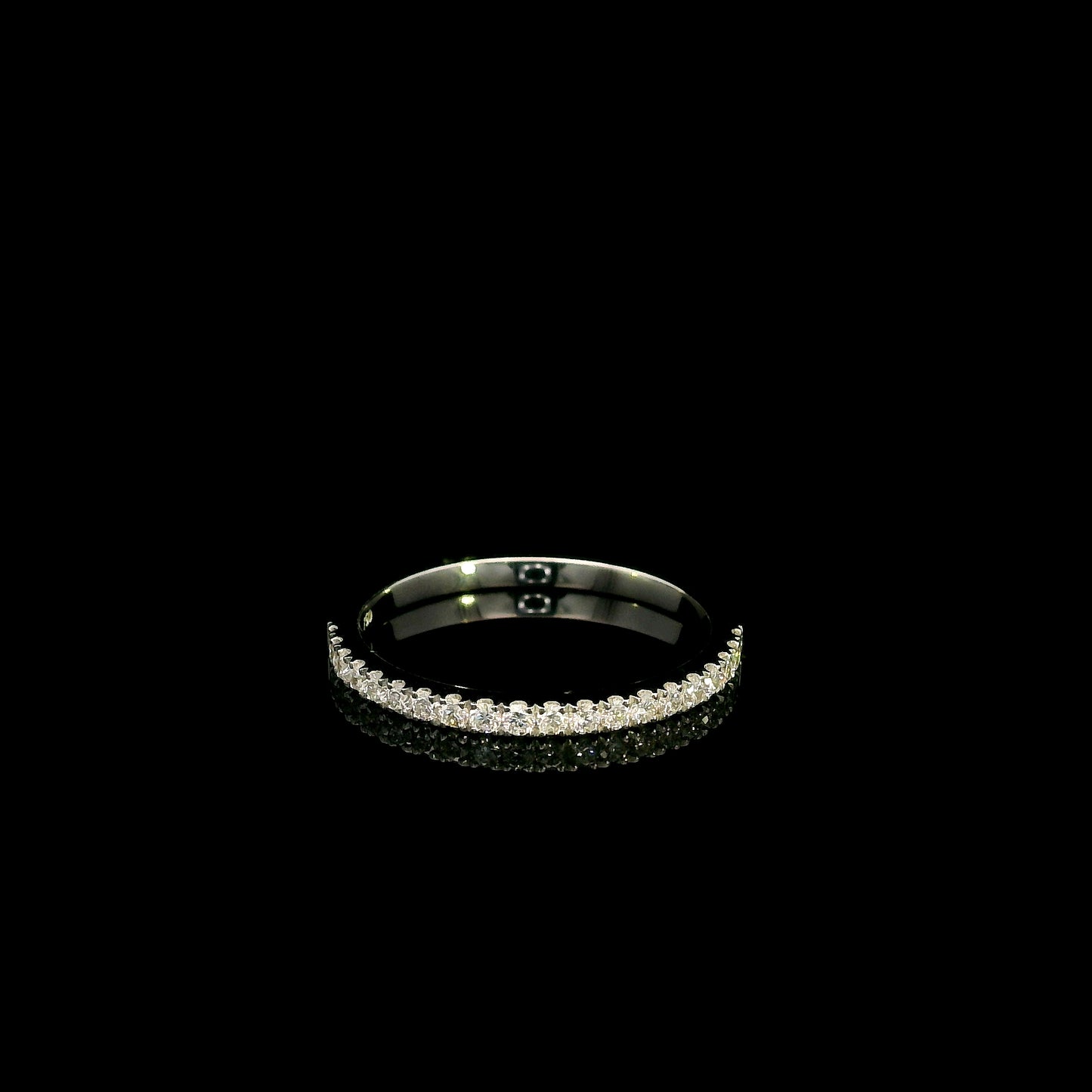 Round diamond bridal set in 18K white gold with GIA certified natural diamond engagement ring and matching diamond wedding band.