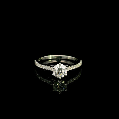 Round diamond bridal set in 18K white gold with GIA certified natural diamond engagement ring and matching diamond wedding band.
