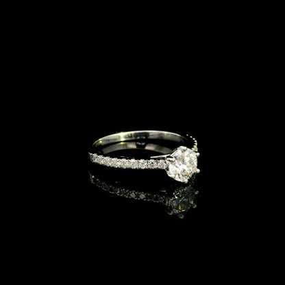 Round diamond bridal set in 18K white gold with GIA certified natural diamond engagement ring and matching diamond wedding band.