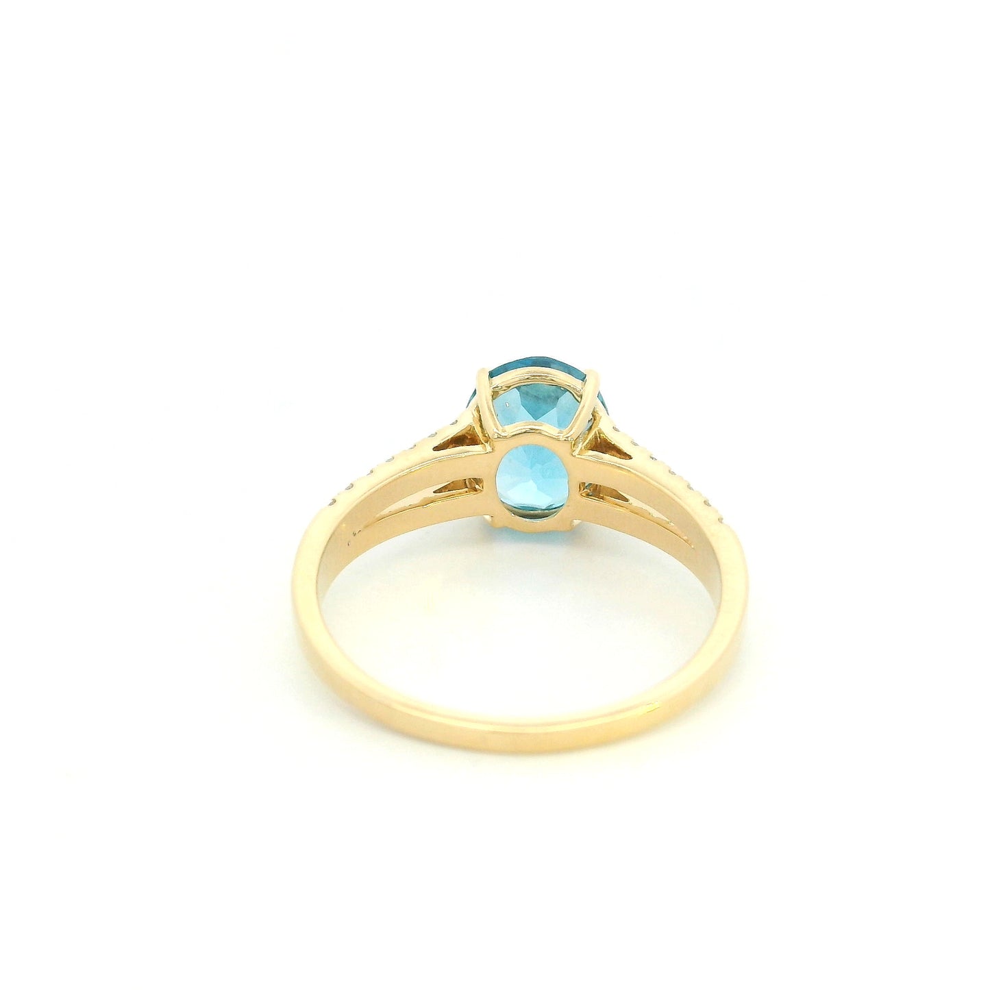 18K yellow gold Swiss blue topaz ring with oval centre stone and double-row diamond split shoulders.