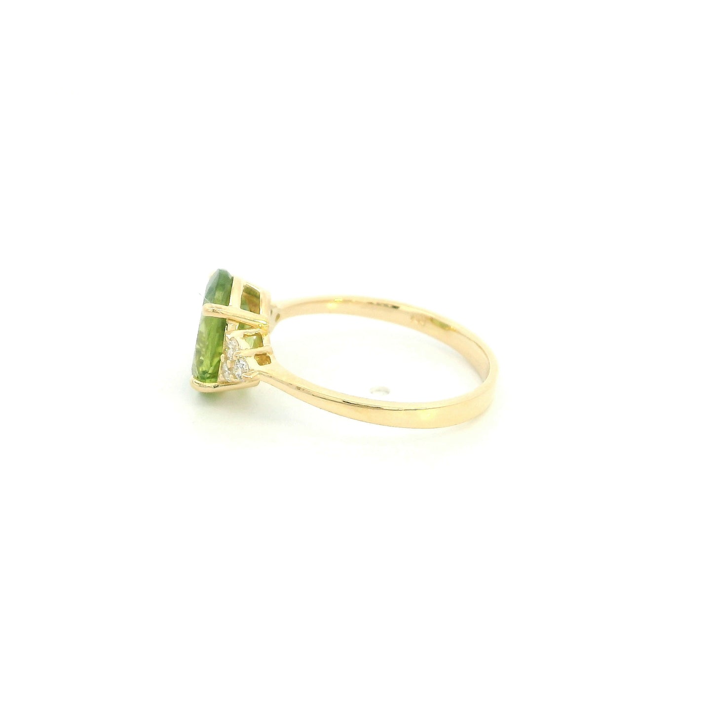 18K yellow gold peridot and diamond ring with oval green centre stone and diamond side accents.
