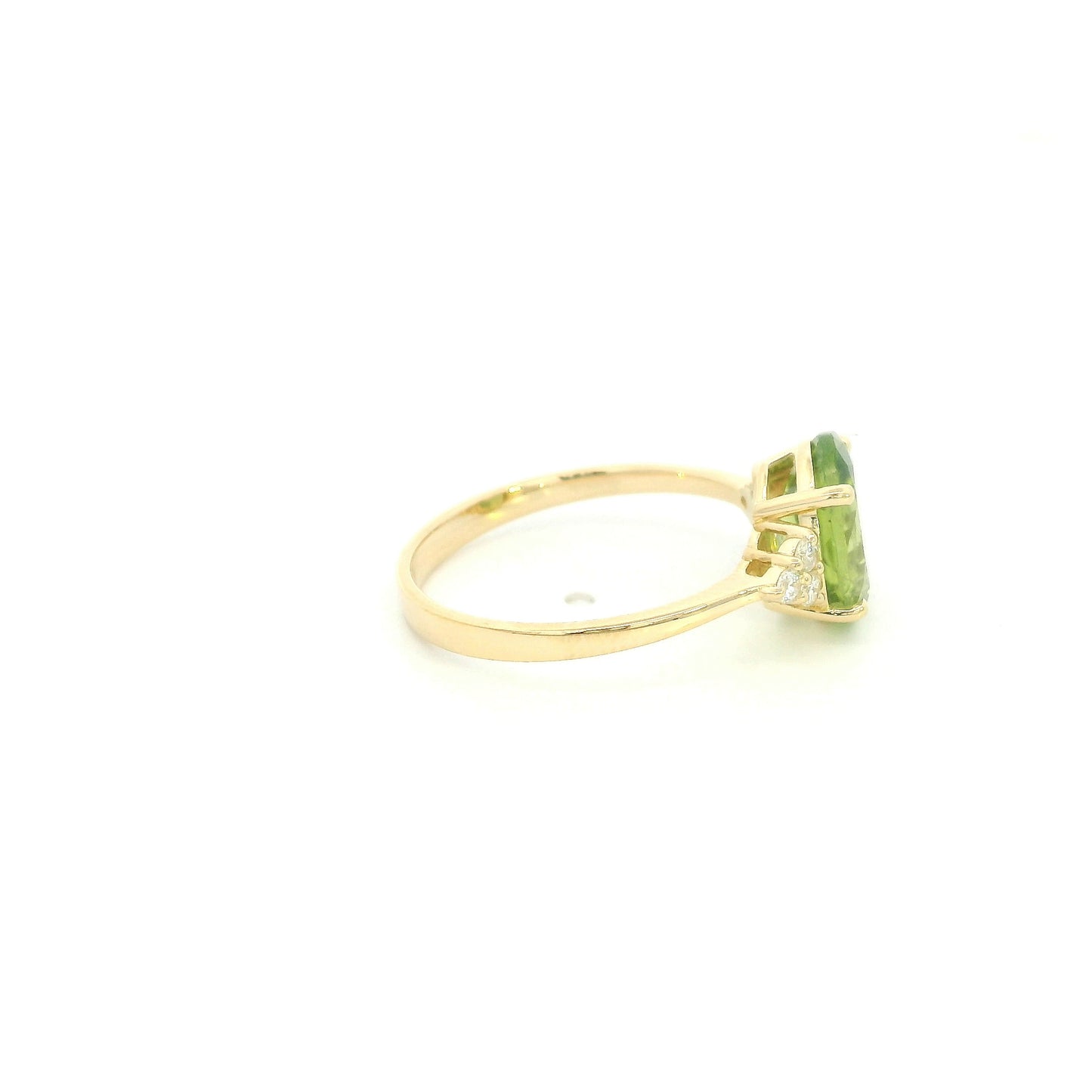 18K yellow gold peridot and diamond ring with oval green centre stone and diamond side accents.