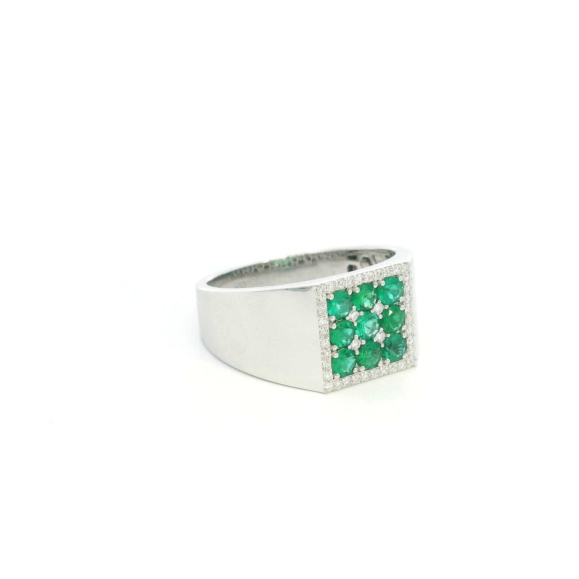 Men’s emerald and diamond signet ring in 18K white gold with nine round emeralds framed by natural diamonds.