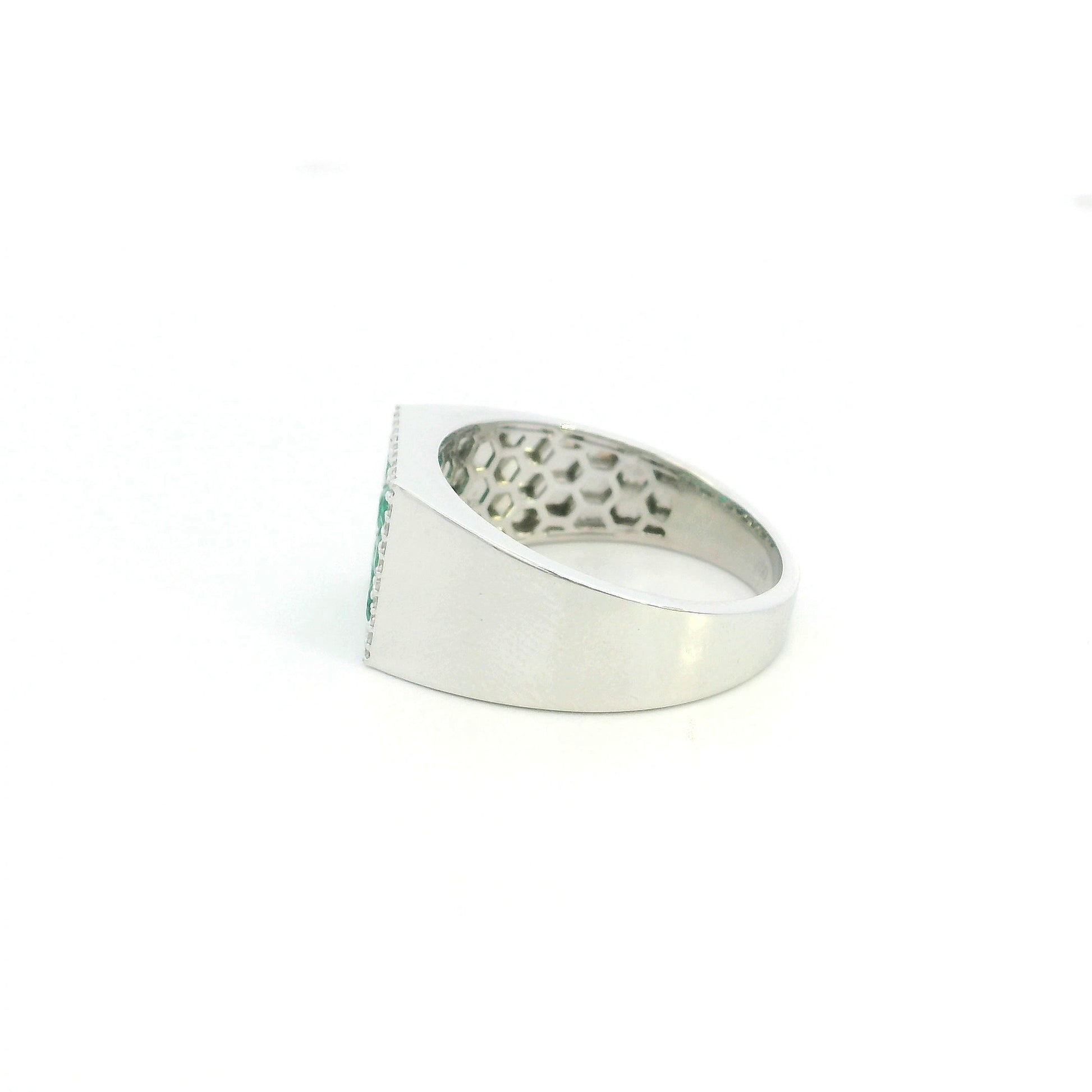 Men’s emerald and diamond signet ring in 18K white gold with nine round emeralds framed by natural diamonds.