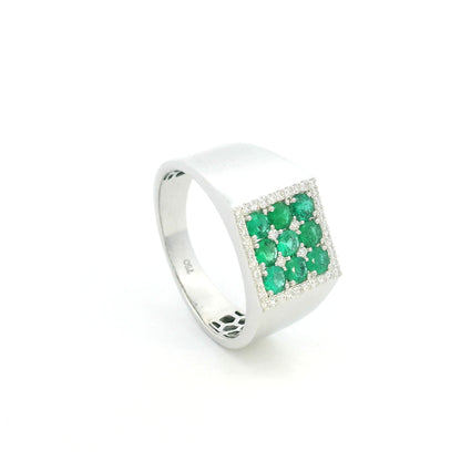 Men’s emerald and diamond signet ring in 18K white gold with nine round emeralds framed by natural diamonds.