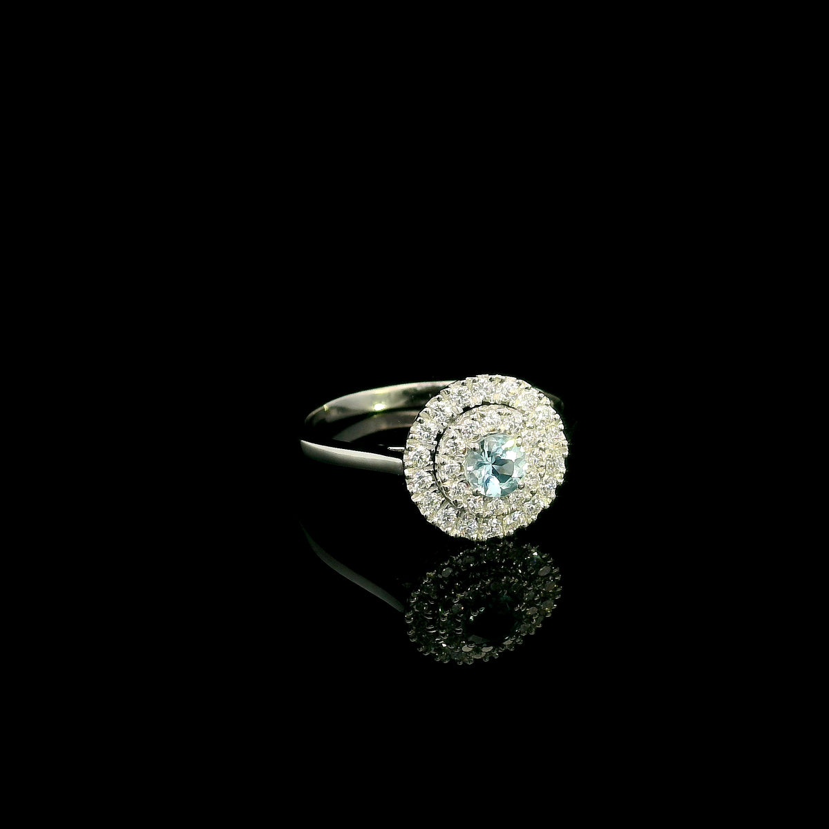 18K white gold aquamarine and diamond double halo ring with round blue aquamarine and two rows of round diamonds