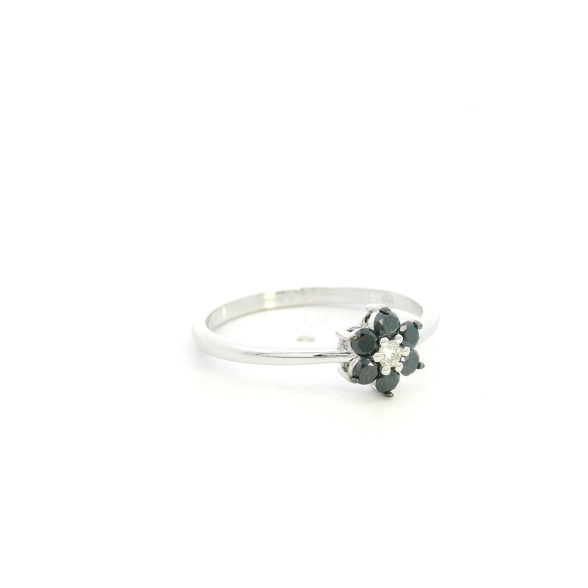 Black diamond flower ring in 18K white gold with black diamond petals and white diamond centre