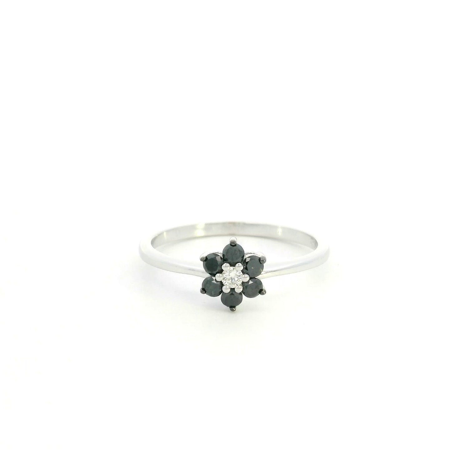 Black diamond flower ring in 18K white gold with black diamond petals and white diamond centre