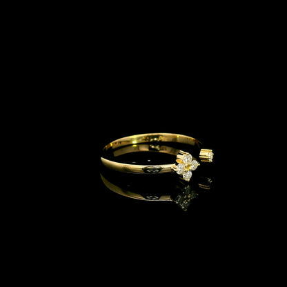 Open diamond flower ring in 18K yellow gold with four-petal diamond floral design and single diamond accent