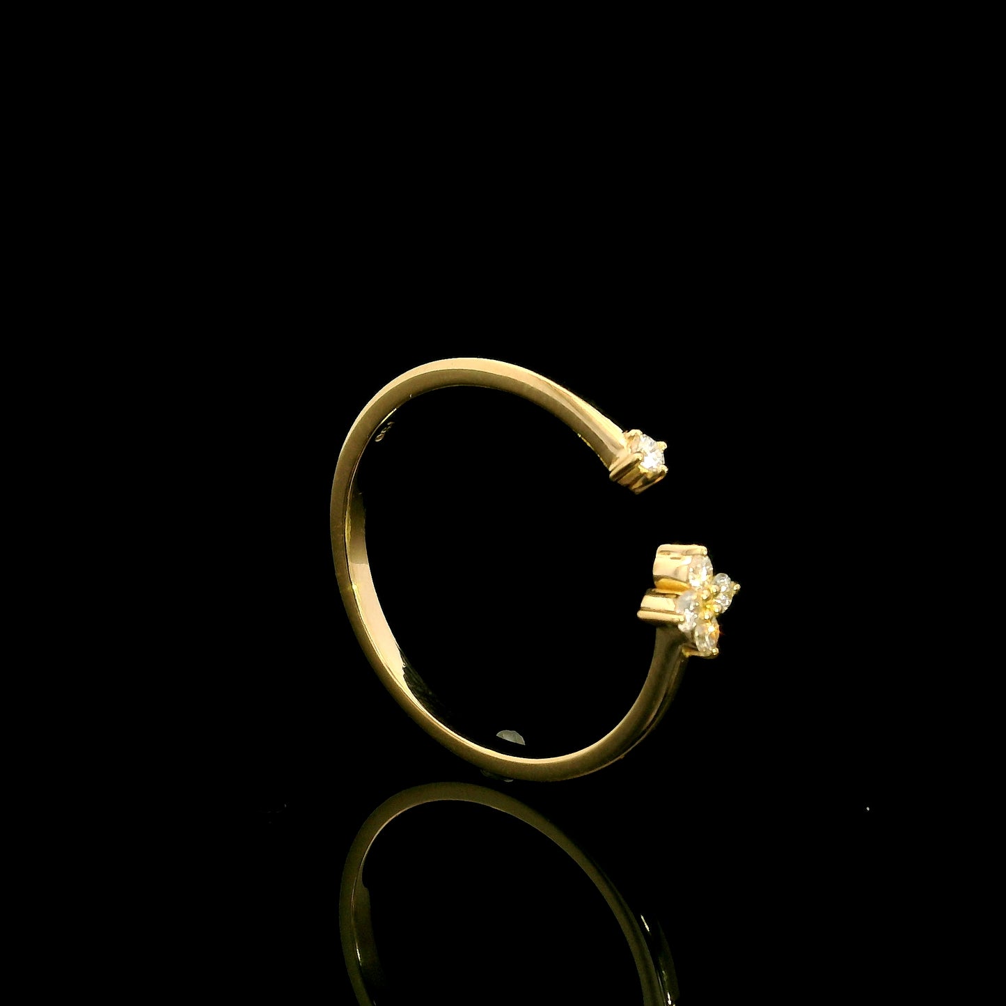 Open diamond flower ring in 18K yellow gold with four-petal diamond floral design and single diamond accent