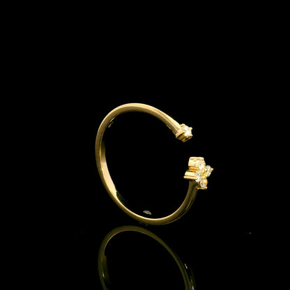 Open diamond flower ring in 18K yellow gold with four-petal diamond floral design and single diamond accent