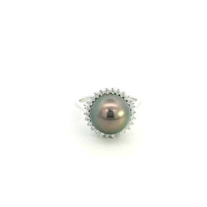 South Sea black pearl and diamond halo ring in 18K white gold featuring a lustrous dark pearl surrounded by round brilliant diamonds.