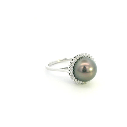 South Sea black pearl and diamond halo ring in 18K white gold featuring a lustrous dark pearl surrounded by round brilliant diamonds.