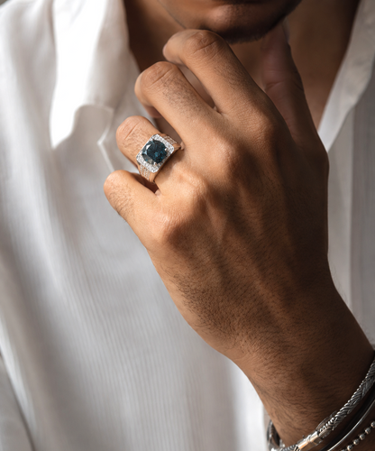 Men’s blue diamond ring with 5.36 carat natural colour-treated blue diamond and pavé diamonds in 18K white gold