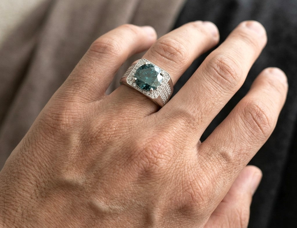 Men’s blue diamond ring with 5.36 carat natural colour-treated blue diamond and pavé diamonds in 18K white gold