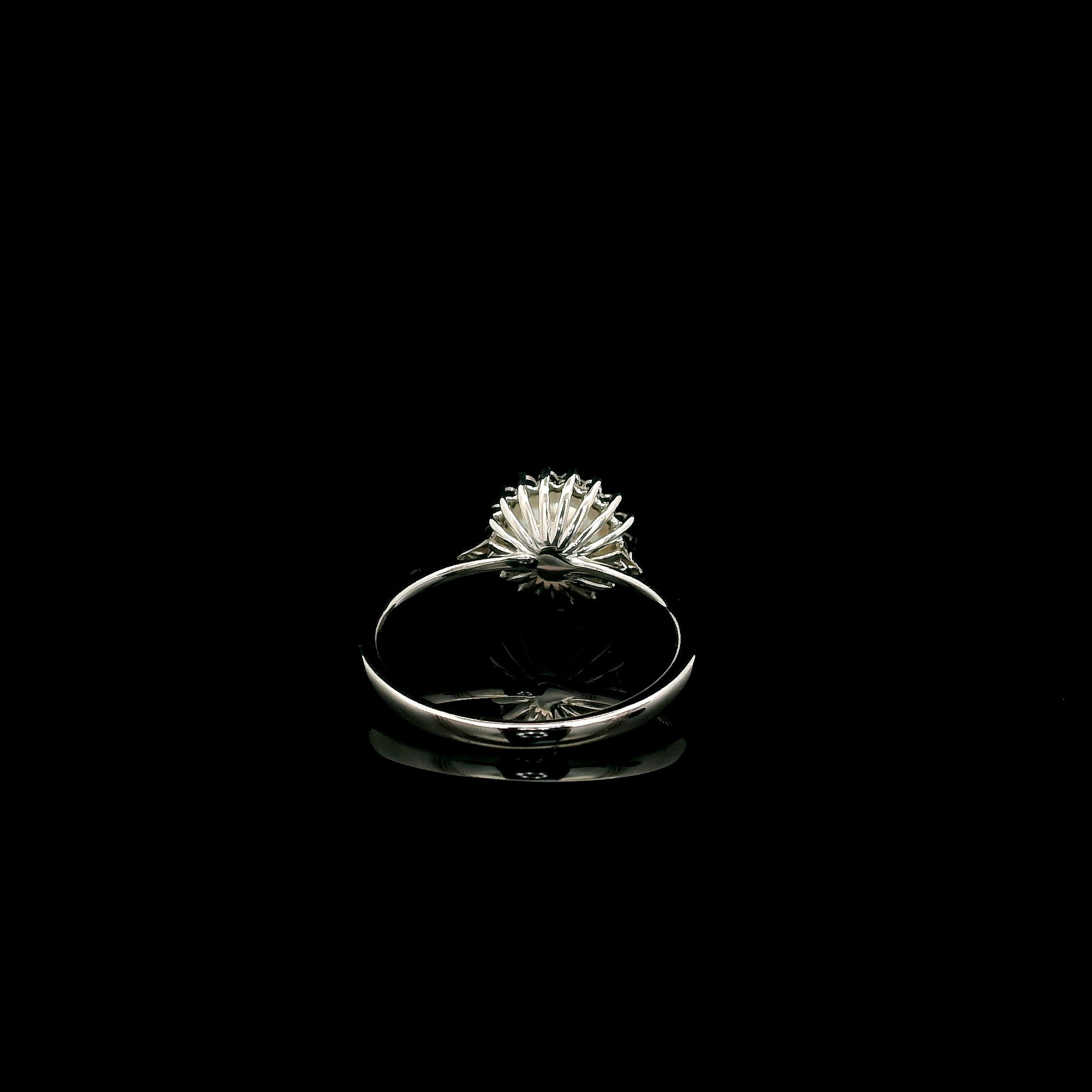 Freshwater pearl and diamond halo ring in 18K white gold with round white pearl and 0.15 carat natural diamonds