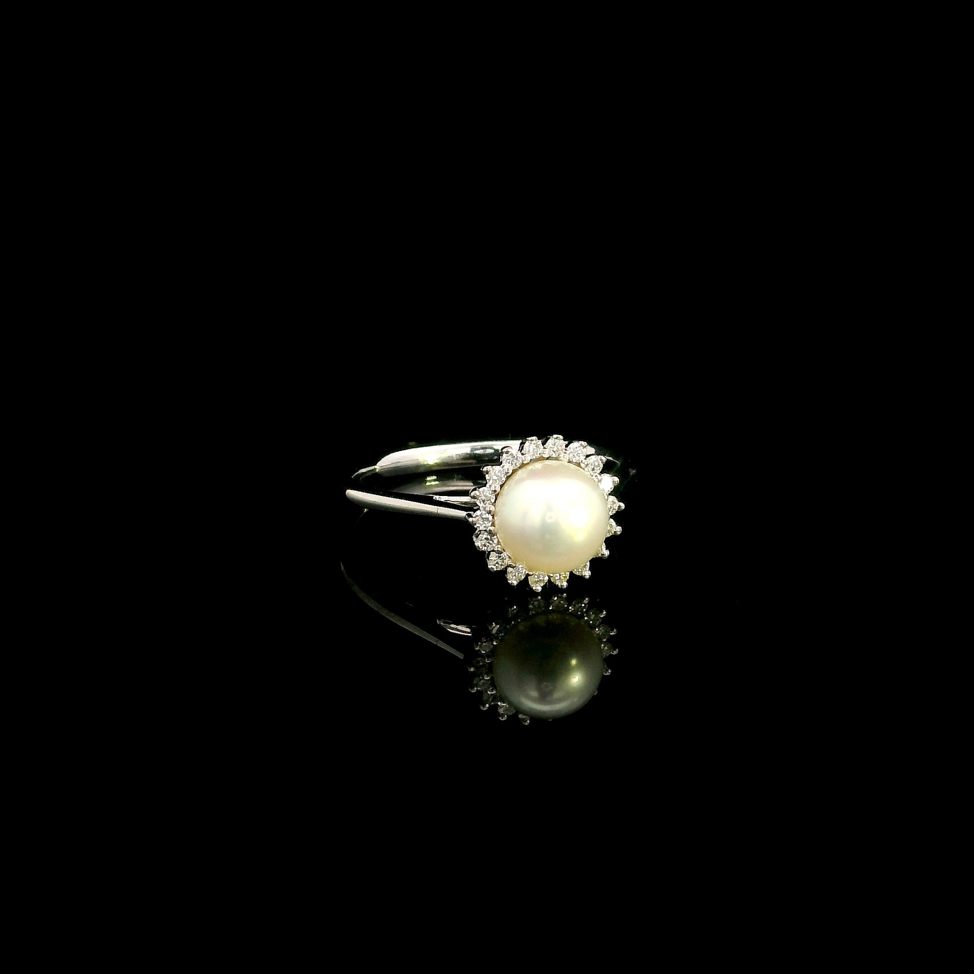 Freshwater pearl and diamond halo ring in 18K white gold with round white pearl and 0.15 carat natural diamonds