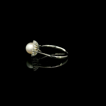 Freshwater pearl and diamond halo ring in 18K white gold with round white pearl and 0.15 carat natural diamonds