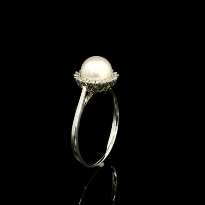 Freshwater pearl and diamond halo ring in 18K white gold with round white pearl and 0.15 carat natural diamonds