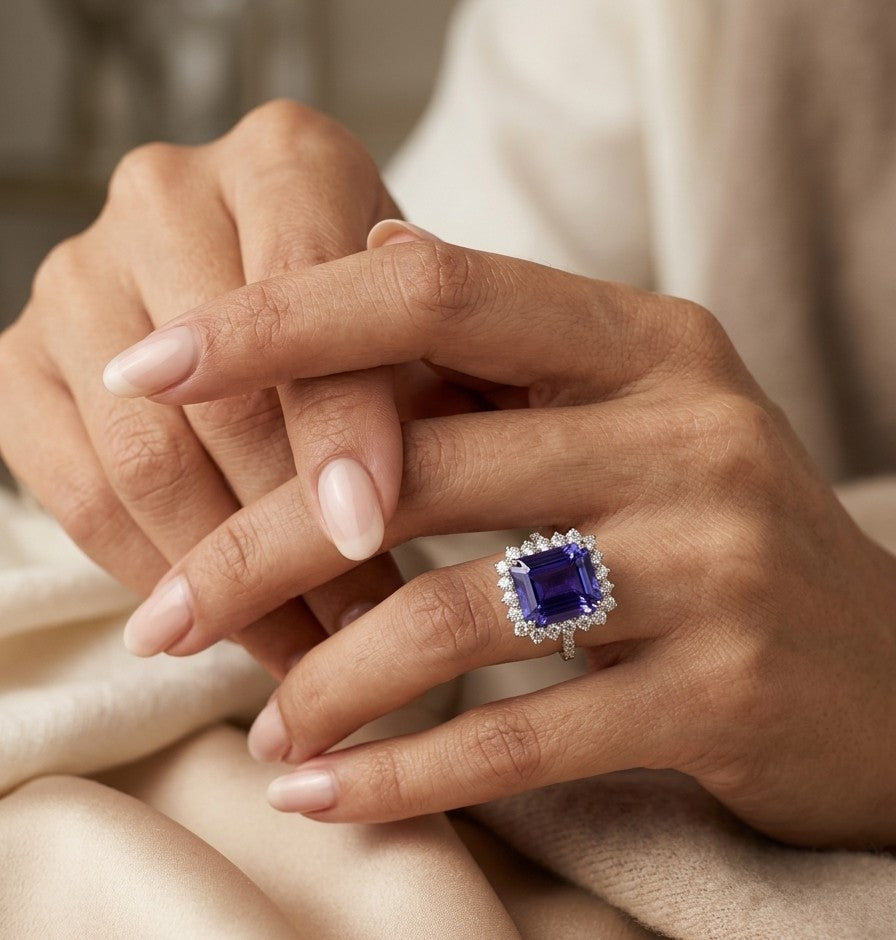 8.78 carat emerald cut tanzanite and diamond halo ring in 18K white gold