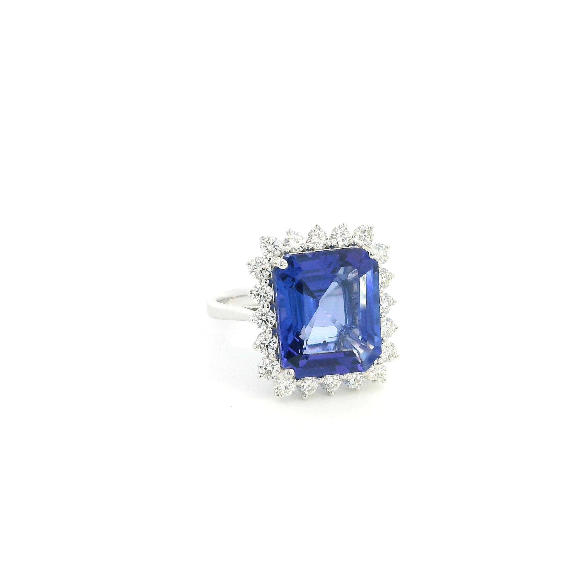 8.78 carat emerald cut tanzanite and diamond halo ring in 18K white gold