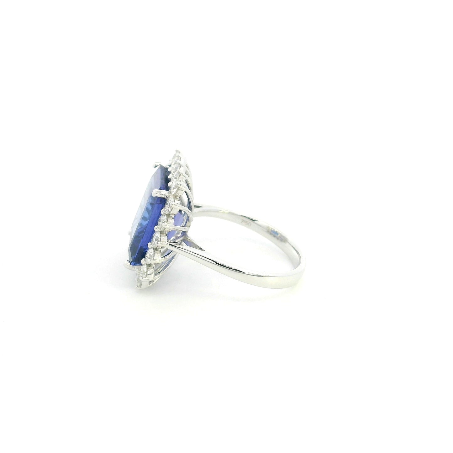 8.78 carat emerald cut tanzanite and diamond halo ring in 18K white gold