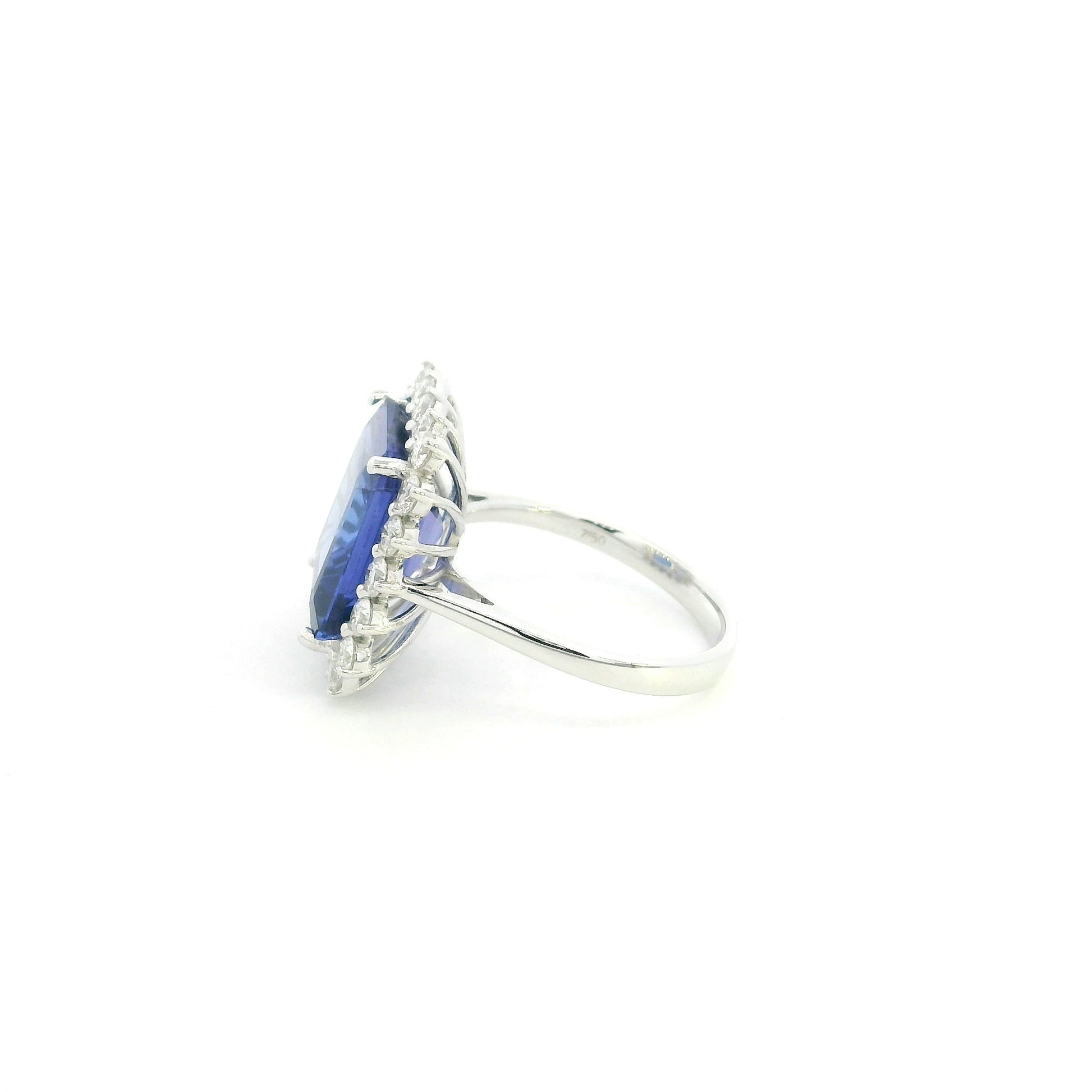 8.78 carat emerald cut tanzanite and diamond halo ring in 18K white gold