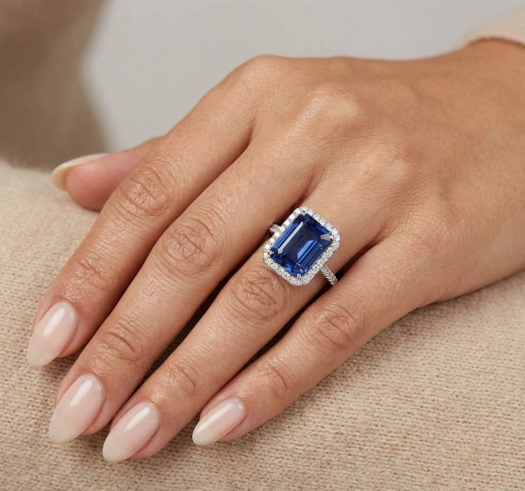 8.20 carat emerald cut tanzanite and diamond halo ring in 18K white gold