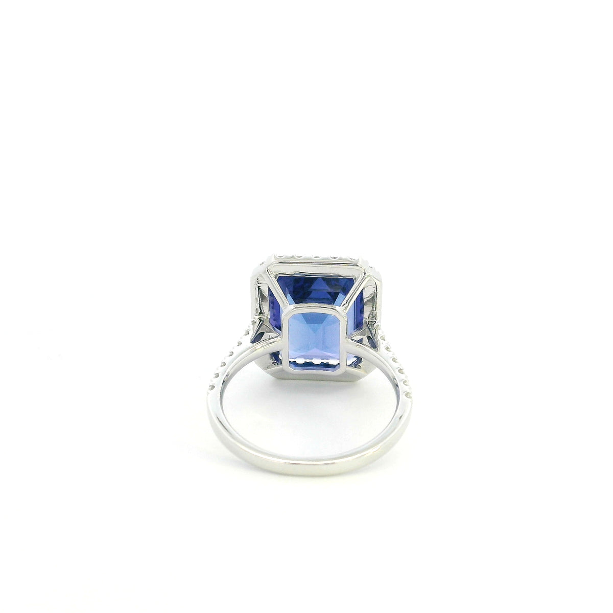 8.20 carat emerald cut tanzanite and diamond halo ring in 18K white gold