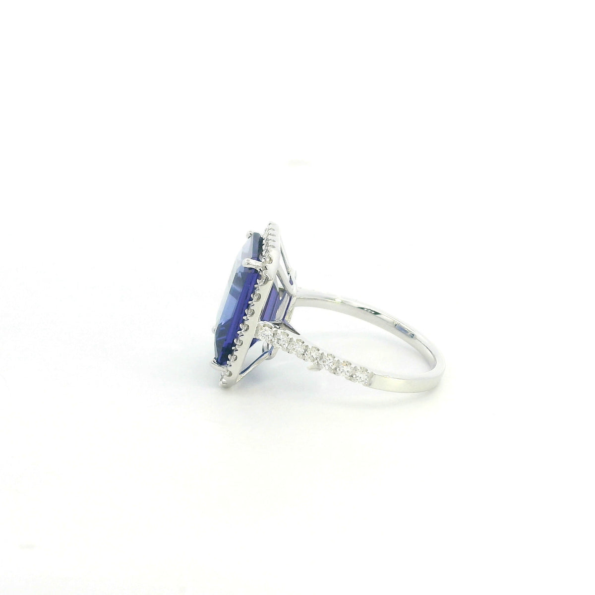 8.20 carat emerald cut tanzanite and diamond halo ring in 18K white gold